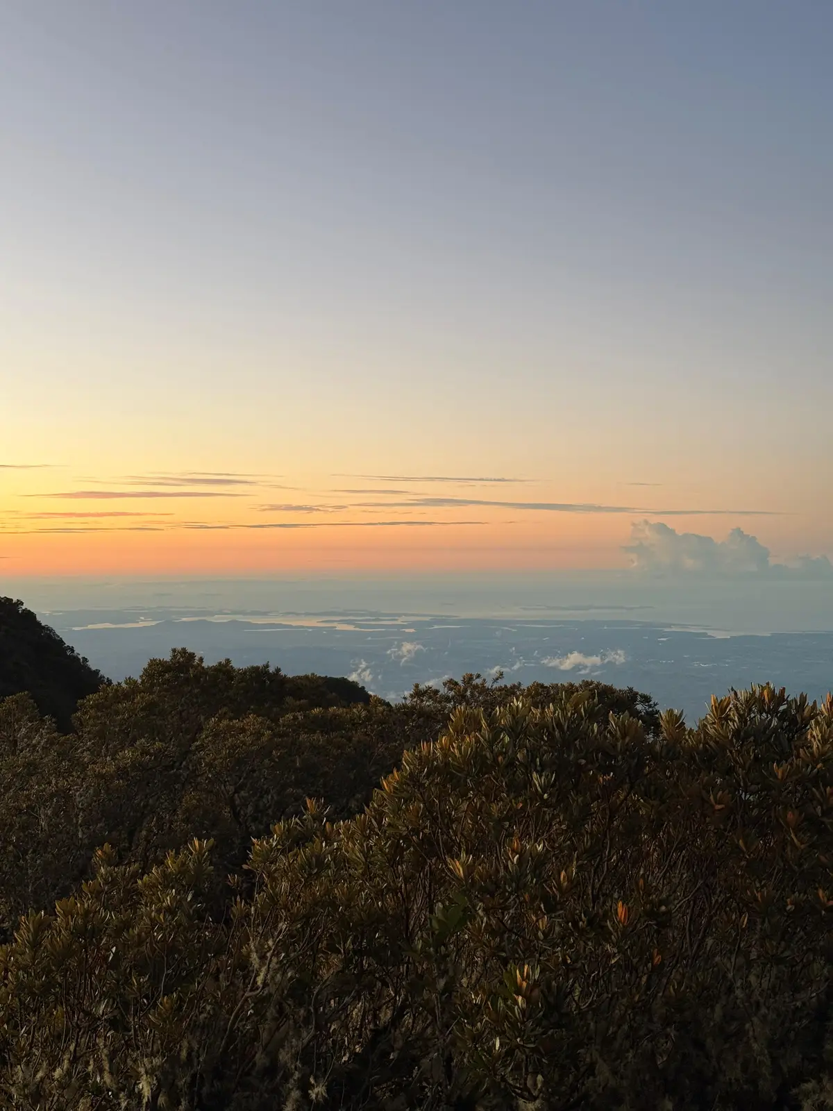 Soft pastel dawn over the Chiriquí highlands seen from Volcán Barú