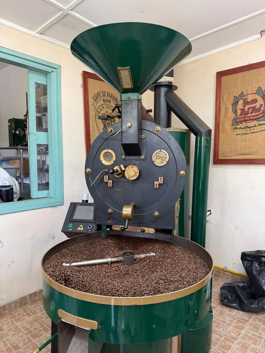 A traditional coffee roaster at work on the Boquete coffee tour